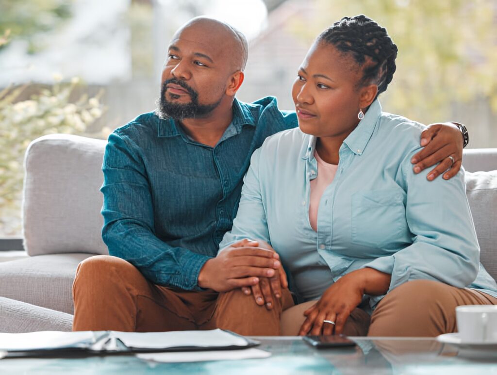 a couple sitting on a sofa